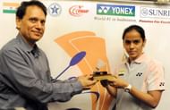 Saina Nehwal receives the "Eddy Choong" Most Promising Player-2008 Award from the president of the Badminton Championship 2009, V.K.Verma during the unveiling of the Yonex Sunrise World Badminton Championship.